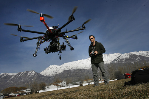 Scott Sommerdorf | The Salt Lake Tribune Chris Newman, owner of Cinechopper, flies a remote controlled drone for shooting aerial photography at a park near his home in Lindon, Saturday, March 2, 2013.