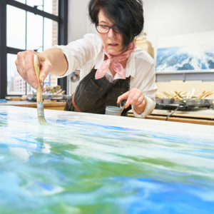Alicia Tormey painting in her studio