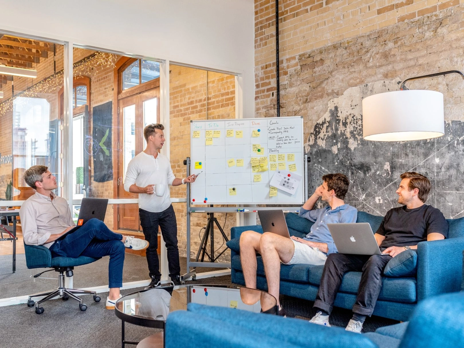 Photo of manager with employees in a meeting