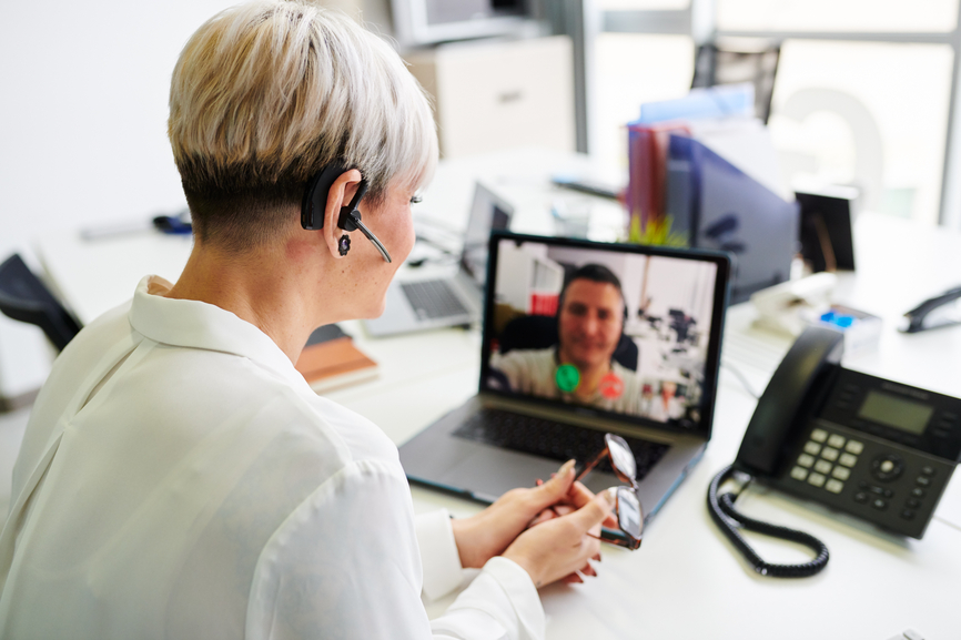 Woman Having Video Call At Table