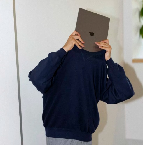 Holding the laptop and thinking about some ideas