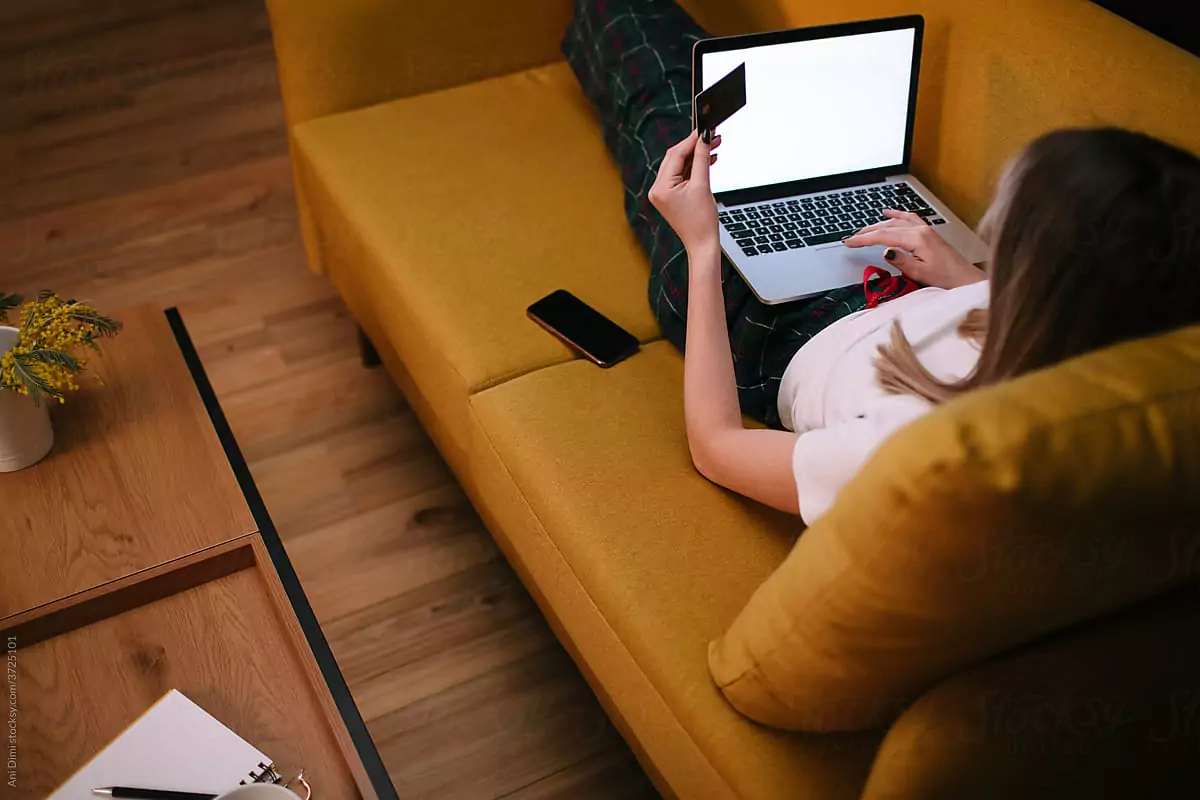 Woman using her credit card to shop online