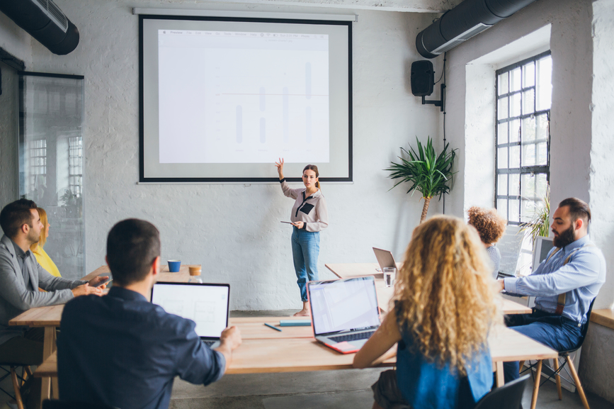 Expert speaker presenting in front of a group.