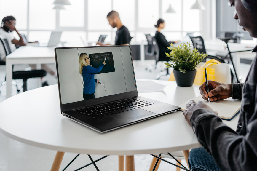 Online learning student watching a lesson on their laptop