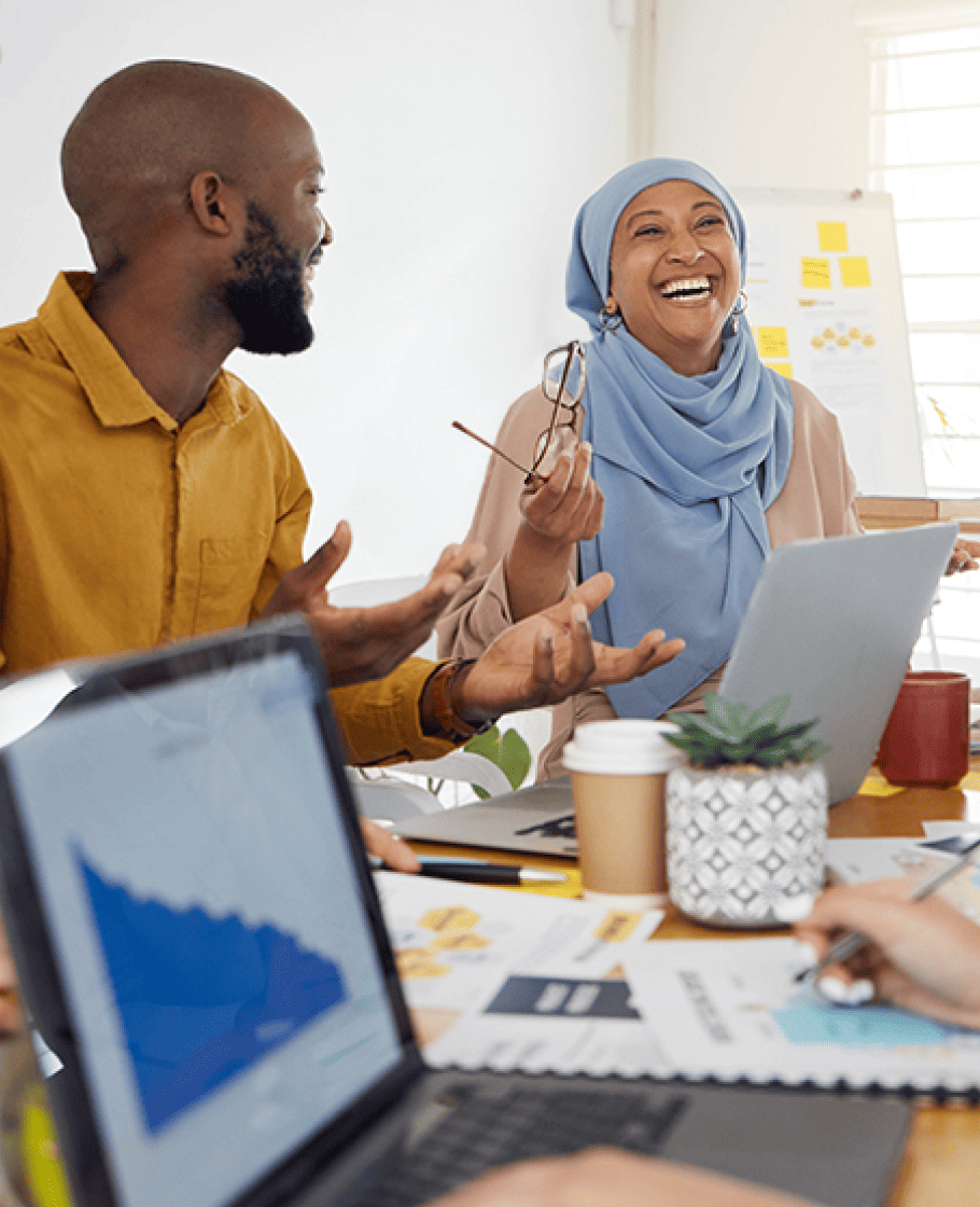 Group of people working in an office together and the lady is smiling