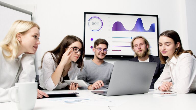 team looking at course completion dashboard