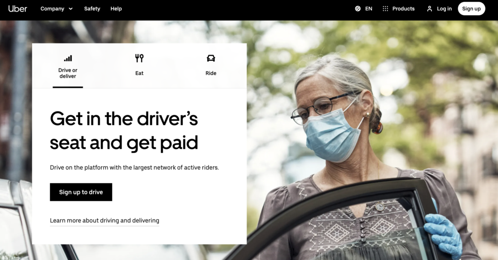 Screenshot of Uber website: get in the driver's seat and get paid. woman standing next to car.