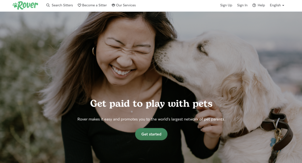 Screenshot of Rover website: Get paid to play with pets. Woman with dog.